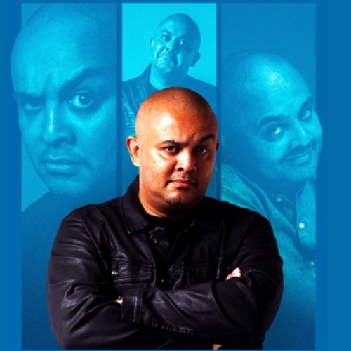 A close up shot of Alfred Adriaan in profile with an eyebrow raised