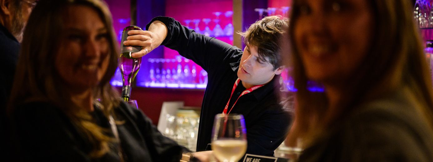 Bar Tender Pouring Wine
