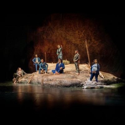 Cast promo shot on stage of the visitors