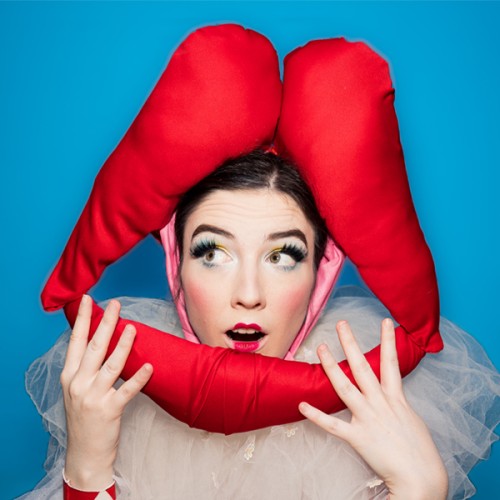 an image of booth the clown agaisnt a blue background with lips around her head. Text reads: Kissing Booth 