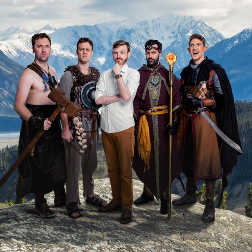 An image of the members of Viva La Dirt League in fantasy costumes agaisnt a mountain backdrops