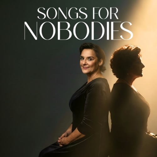An image of Jackie Clarke looking up wistfully in a black dress witha spot light on her. Text reads Songs for nobodies 