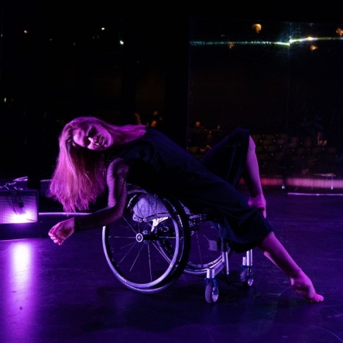 A woman dancing in a wheelchair